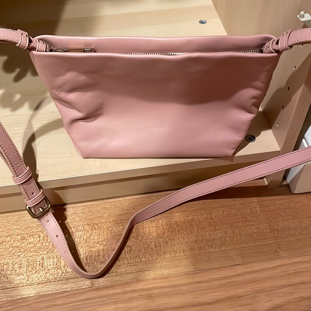 Jcrew leather purse with zipper top and one zipper inside.
